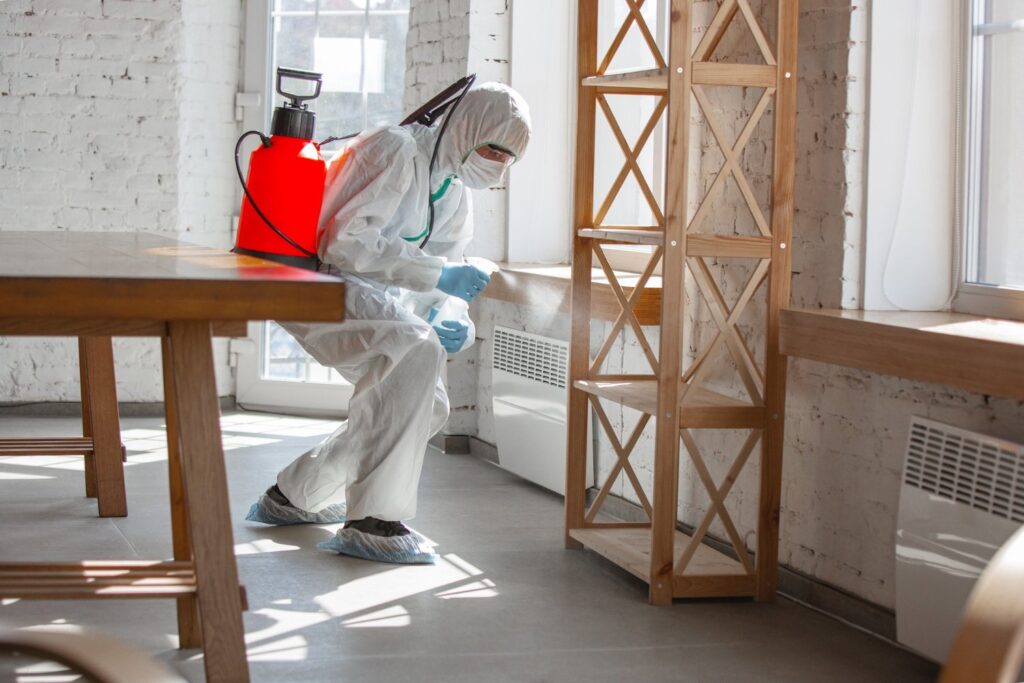 exterminator spraying building
