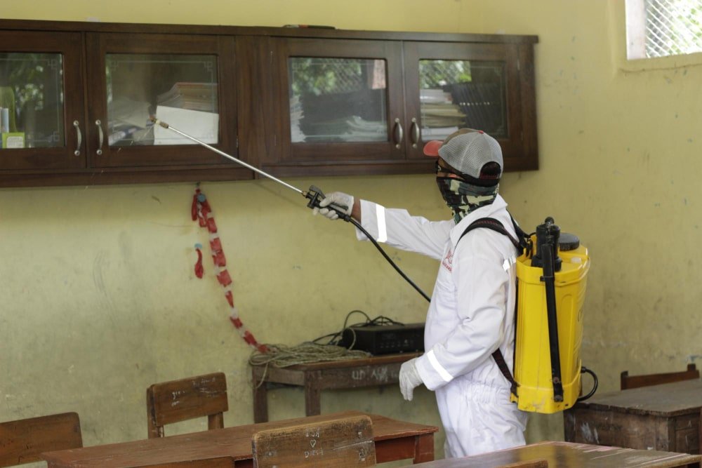 man spraying a home for pests